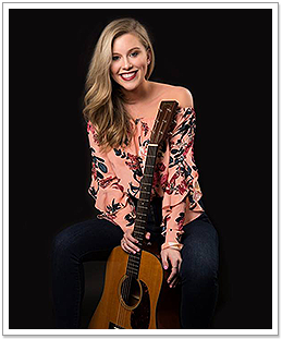 Blonde Woman Holding Guitar